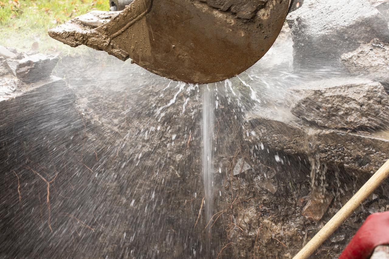 Water spraying from a large shovel