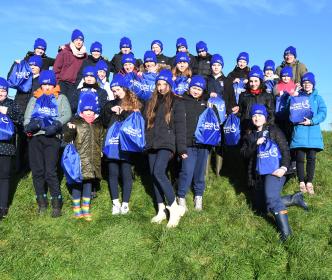 Children from Bunscoil an Chlochair planting trees at Dingle Water Treatment Plant